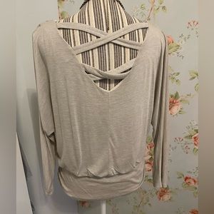 Super cute flowy top with batwing sleeves and cute back detail